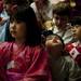 A participant of the Dicken Elementary School's Community of Cultures Assembly and Celebration looks up before introducing himself on Friday, April 12. AnnArbor.com I Daniel Brenner